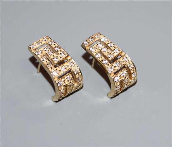 A pair of 585 yellow metal and diamond set curved earrings, 17mm.
